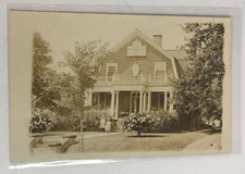 Vintage Postcard House with Three Children Outside Brick House