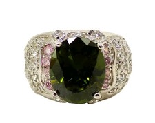 Green oval cubic zirconia stone ring with clear CZ stones on each side Size 7