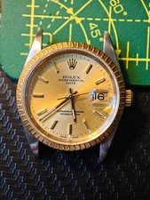 Rolex Oyster Perpetual Date 15223 18K Gold Bezel Steel Champagne Dial 34mm