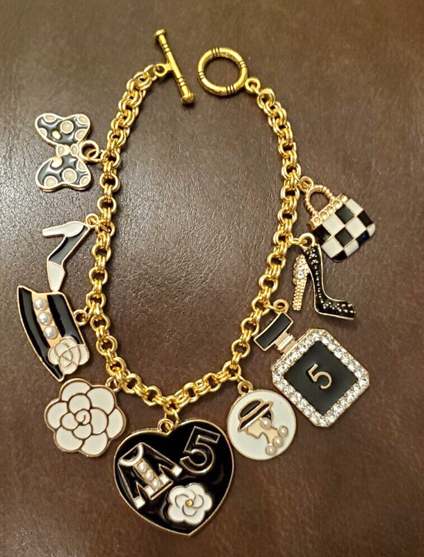 Fun fashion black & white bracelt gold tone with 9 charms high heels, purse, hat