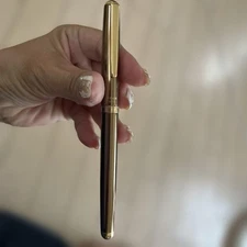 Gold and brown fountain pens