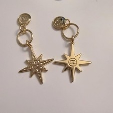 CHANEL Holiday 2022 Christmas Limited Edition Novelty Charm Set of 2 "Comet"