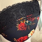 Black padded underwire bra with red rose floral print, black lace trim, and “38D” tag at the side.