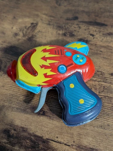 Retro Schylling Atomic Tin Litho Space Ray Gun reproduction