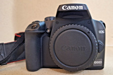 Canon EOS 1000D DSLR Digital Camera, battery and strap.