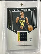 2024-25 Noir Cody Williams Elegant Décor Rookie Jerseys Int #/20 - 22297
