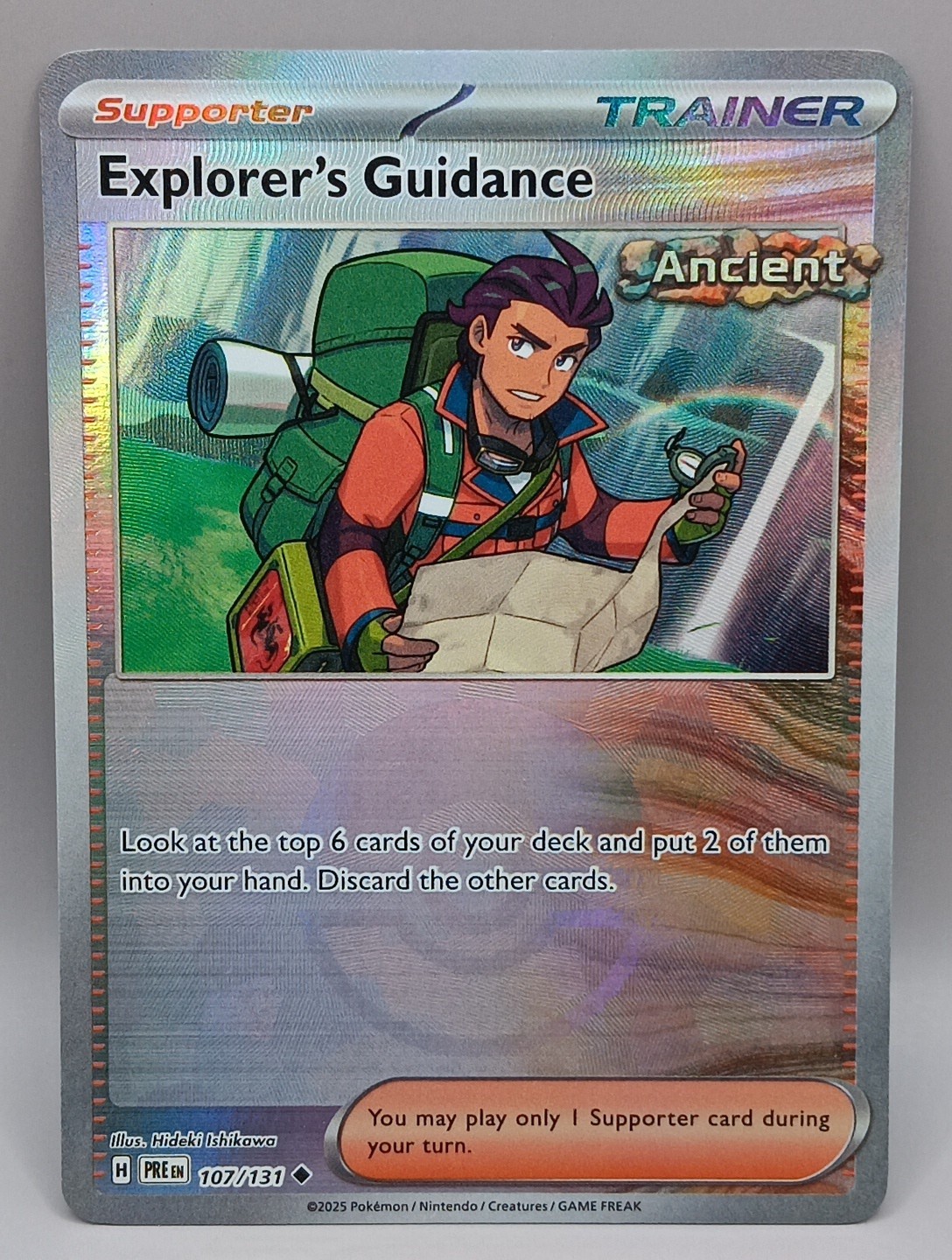 EXPLORER'S GUIDANCE 107/131 PRISMATIC EVOLUTIONS POKEMON (POKE BALL HOLO, NM)