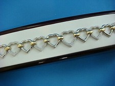 12 HEARTS 14K YELLOW AND WHITE GOLD LADIES DIAMOND BRACELET, 7" LONG, 23.6 GRAMS