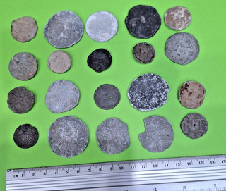 20 lead/pewter tokens some could be seals Varying age mostly well worn