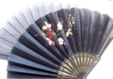 Two early 20th century fans, one with painted floral decoration