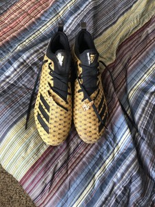 gold money bag cleats
