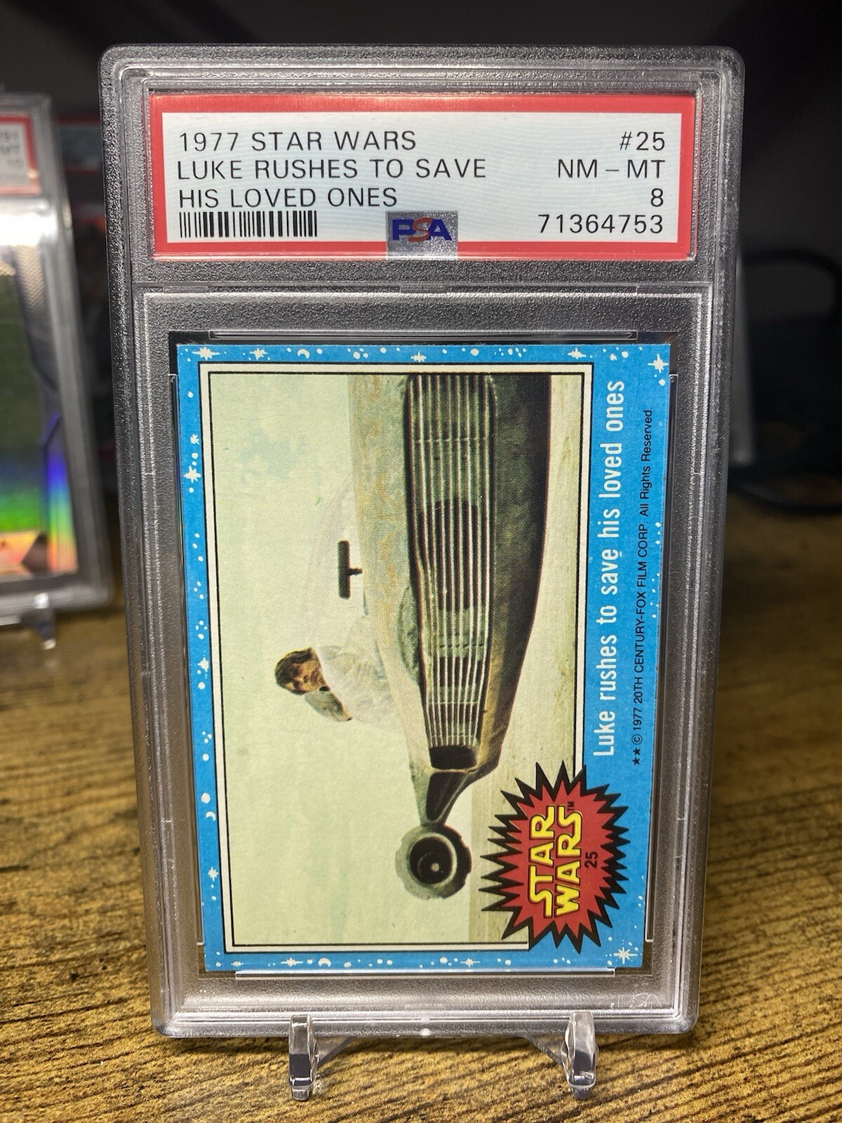 1977 Star Wars Topps - Luke Rushes To Save His Loved Ones #25 PSA 8