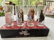 4 Wizard of Oz Glass Tumblers Dorothy Lion Witches Tin Man Scarecrow
