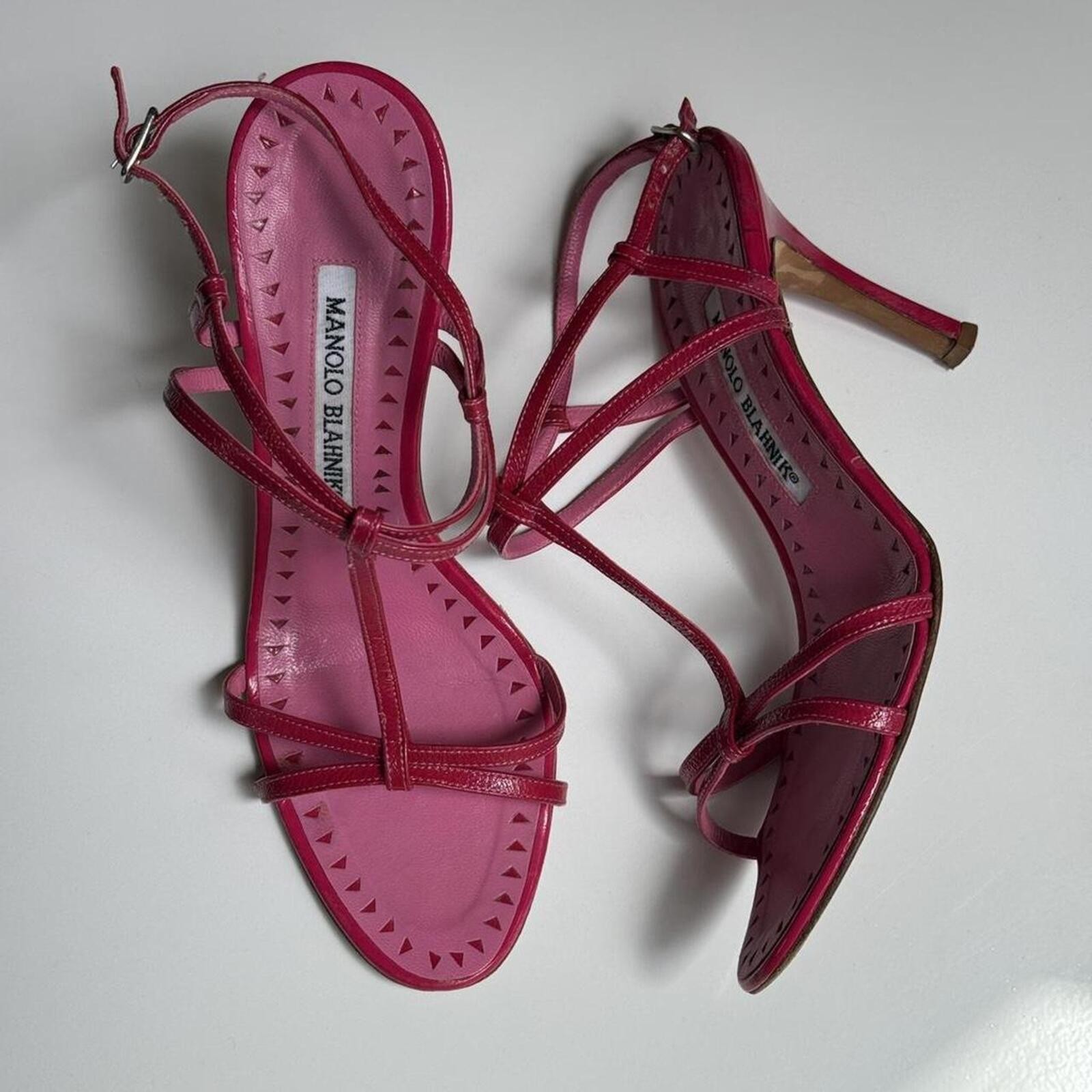 Vintage Manolo Blahnik hot pink patent leather strappy sandal heels.