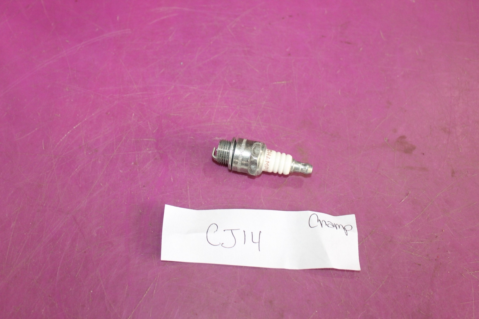 Champion CJ14 Spark Plug. See pic.