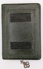 Book Shaped Piggy Bank With Key marked The Life Insurance Savings Bank