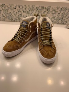 brown vans with fur inside
