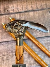 handmade Description: Material : Brass  Wood Finish : Shiny Brass Handle stick