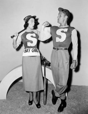 American actor Robert Stack flexing his bicep which contains a bas- Old Photo