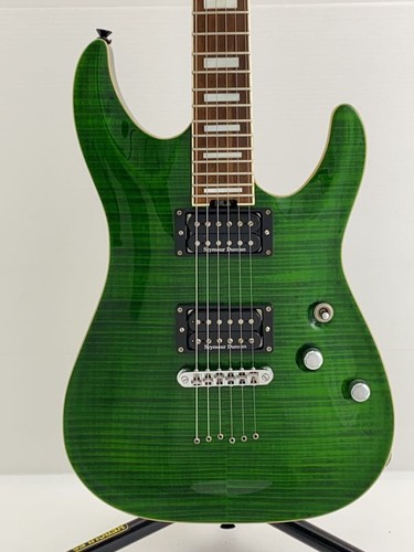 Green SCHECTER PA-SW/TH/See-Thru electric guitar with silver hardware, black pickups, and flamed maple fretboard.