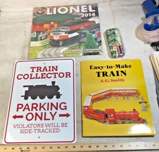 Train Collectors Package: Lionel Watch and Calendar, Paper Train, Train Sign (C)
