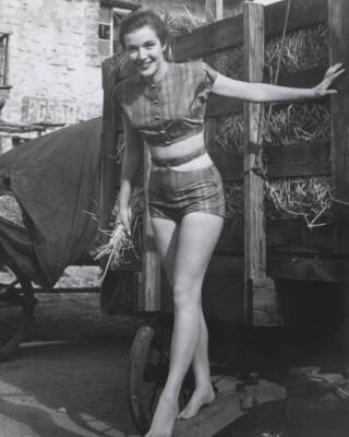 Cathy Downs poses barefoot in two piece swimsuit circa 1950 Old Photo