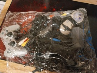 Ps1 Snes Controllers And Bag Of Plugs And Cables.