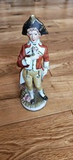Antique German porcelain figurine a young boy in 18th-century colonial attire