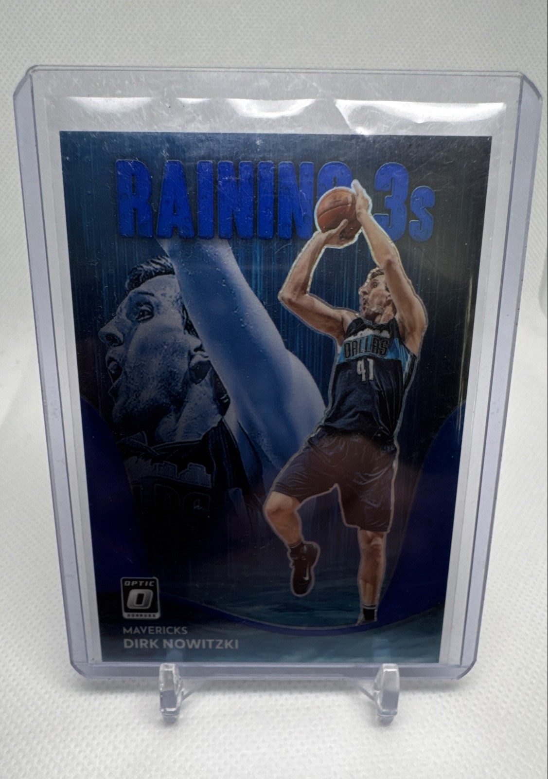 2022-23 Panini Donruss Optic - Raining 3s Dirk Nowitzki #19 Blue Prizm /49