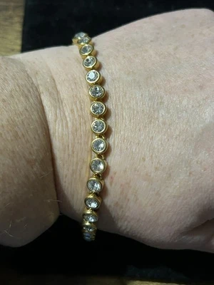 Vintage Avon Clear Crystal Yellow Gold Plated Tennis Bracelet Bangle - Image 1 of 4