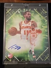 2025-26 Under Wraps Emanate NBA Signed 8x10 Trae Young Green 70/99 AUTO