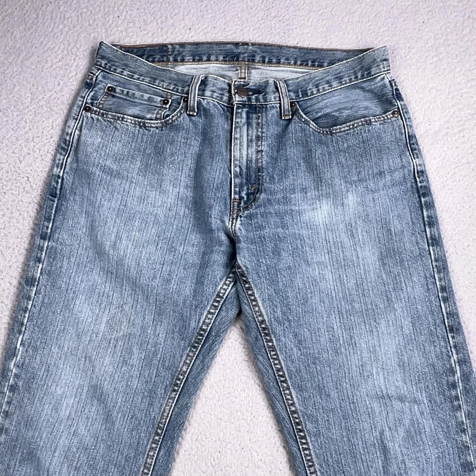 Pantalones de mezclilla Levis 569 para hombre 34x32 azul lavado claro sueltos rectos cremallera mosca lengüeta roja Foto 2 de 4