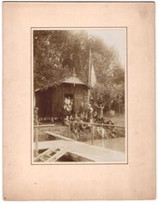 Photography swimming club, men & boys in front of clubhouse on the shore with jetty
