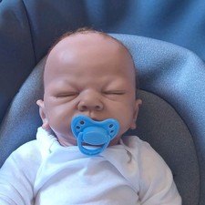 Sleeping Baby Doll Eyes Closed, Blue Pacifier, White Outfit Brown Hair