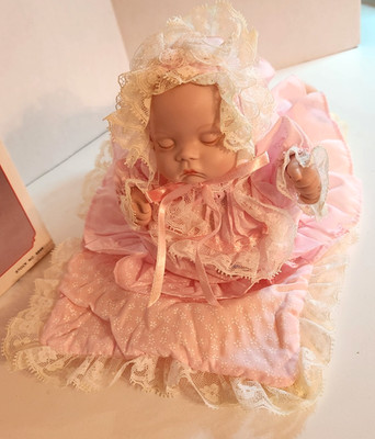 Vintage Moving Musical Porcelain 9'' Laying Baby Doll plays ''Brahm's Lullaby''