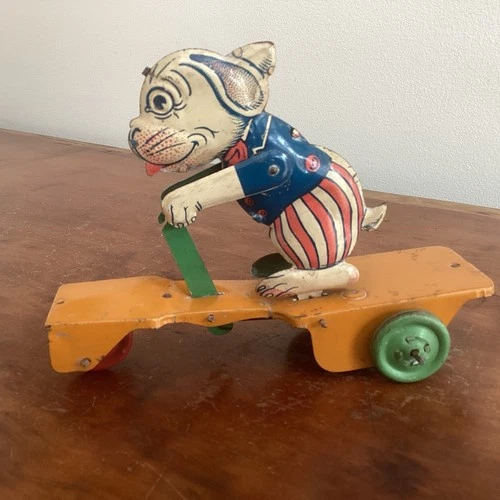 J. Chein tin lithograph Bonzo scooter pull toy 1930s