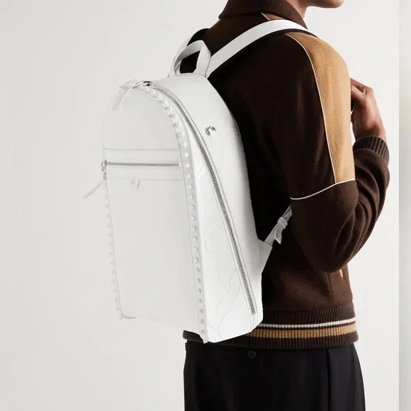 Christian Louboutin — CHRISTIAN LOUBOUTIN Backparis Spiked Rubber-Trimmed Full-Grain Leather Backpack