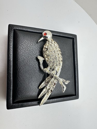 Spilla vintage strass tono argento uccellino arroccato spilla occhio rosso vendita immobiliare leggi