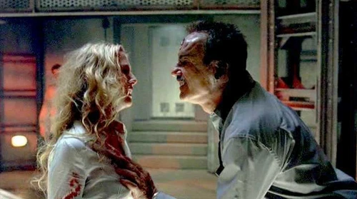 BEYOND RE-ANIMATOR DVD cover showing a pale woman in white clothing reaching out to a man in a dark suit on stairs.
