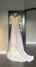 1950s vintage ivory wedding dress with lace bodice, lace trim, and long train