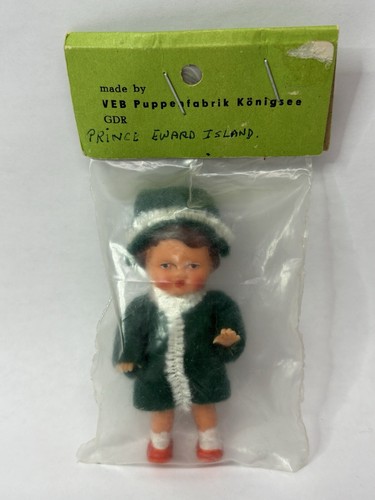 NEW IN PACKAGE VEB Puppenfabrik Konigsee GDR 3" Miniature Rubber Doll Green Coat - Picture 2 of 4