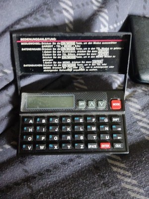 Ashten Data Bank 10 Digit Calculator Clock Calendar Address memo minder.