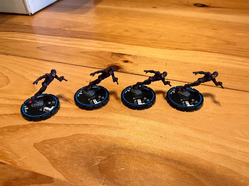 Heroclix Paladin (Armor Wars), aka Heroscape C3V Command Courier.  Four figures
