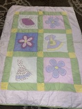 Baby girl crib quilt with dresses and flowers