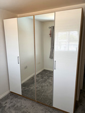 White Gloss Two Freestanding Wardrobes, 4 Hinged Mirrored Doors, Hanging Rail