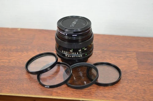 Canon FD 50MM 1:1.8 Lens for Canon FD Mount 35MM SLR PLUS 5 FILTERS