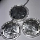 Three One Ounce Buffalo Silver Rounds In Capsules.
