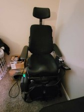 Three month old used permobil electric power wheelchair. It is black, cloth seat