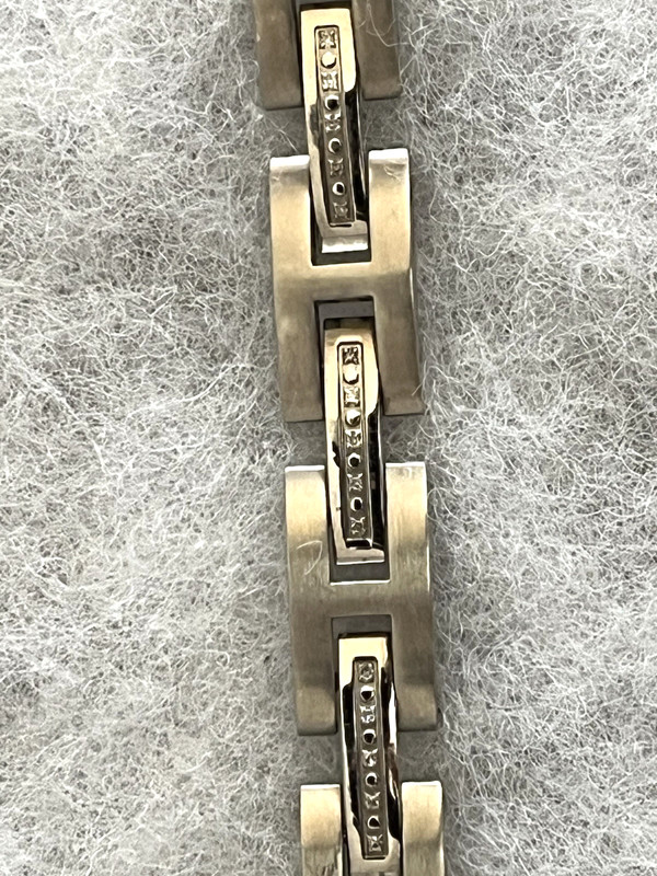 MENS STAINLESS STEEL BRACELET   MARKED MGW, DIA  8.25"