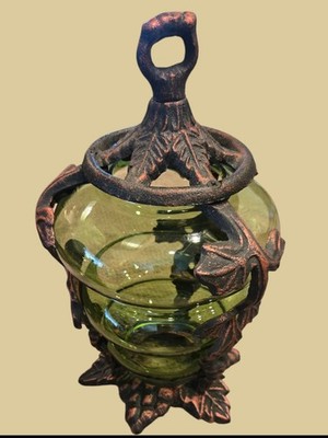 Green art glass and wrought iron candle holder